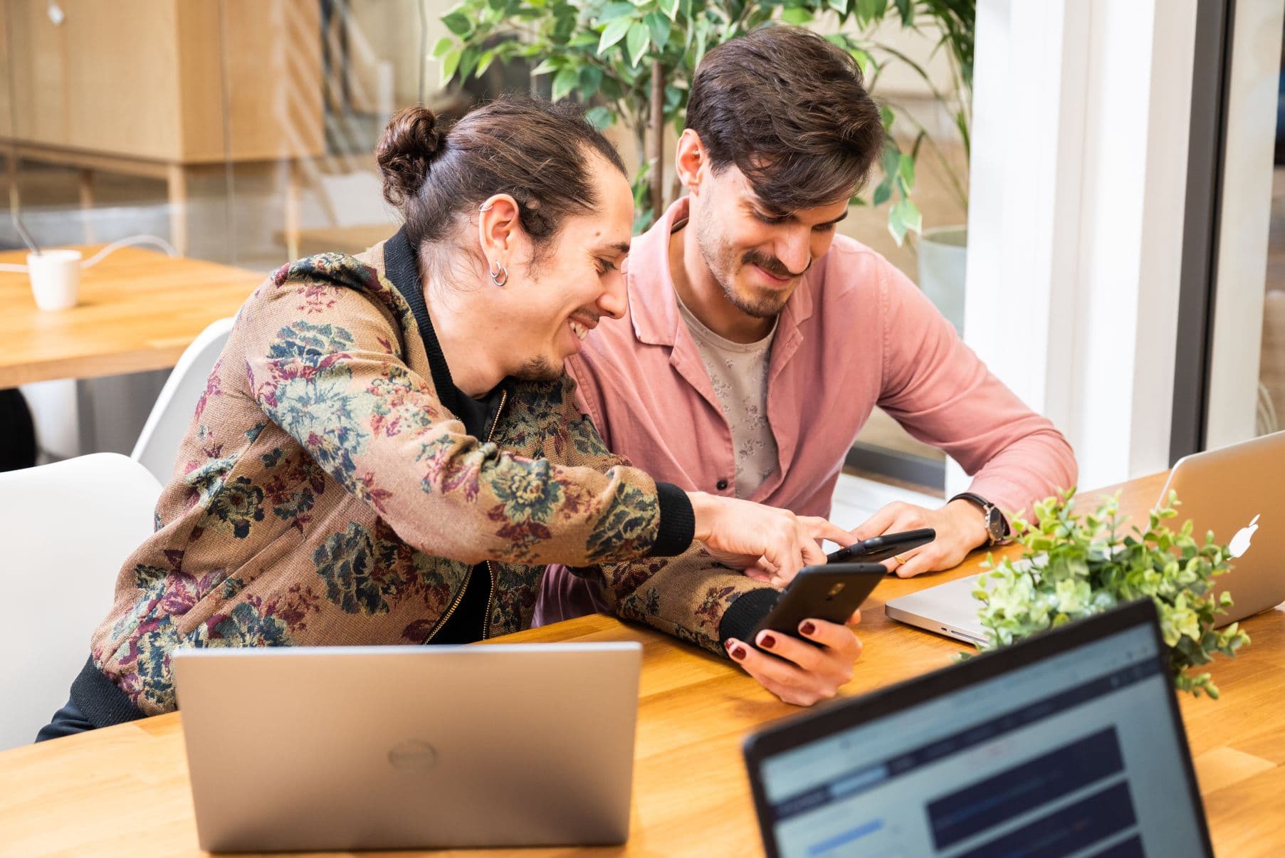 Two guys working with their phone